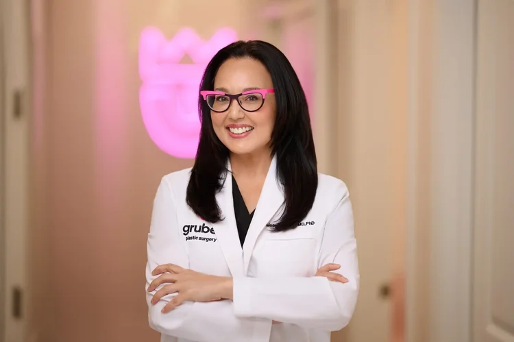 Portrait of a woman clinician in a white coat.