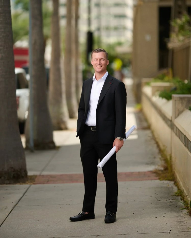 Outdoor portrait of a man in a dark suit