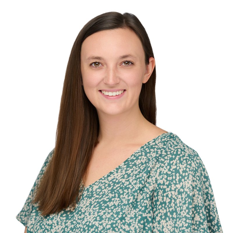 Dees Insurance studio headshot on a white background — green patterned blouse