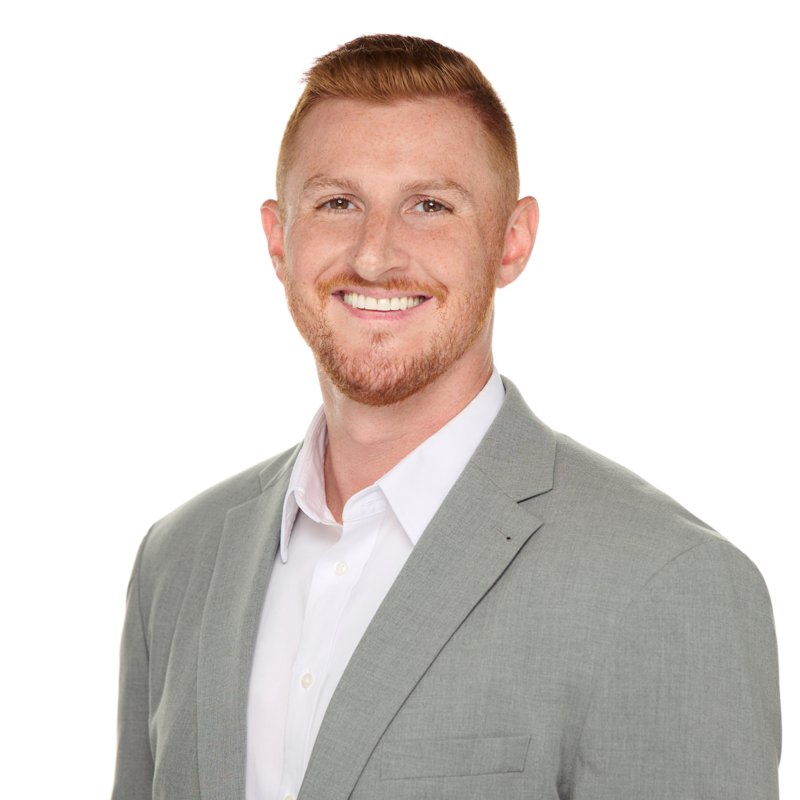 Dees Insurance studio headshot on a white background — gray blazer and white shirt