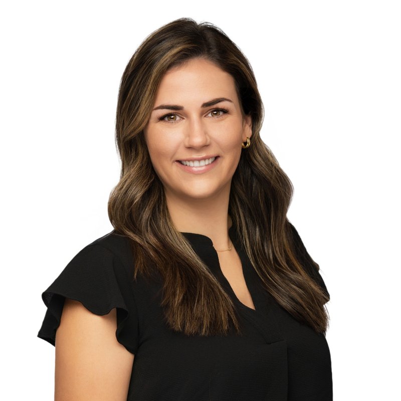 Dees Insurance studio headshot on a white background — black blouse and highlighted hair