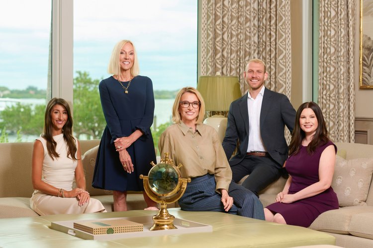 Real estate team portrait in a bright modern interior