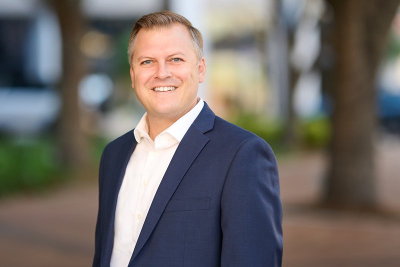 Zarghami Group portrait in downtown Sarasota — navy blazer and white shirt