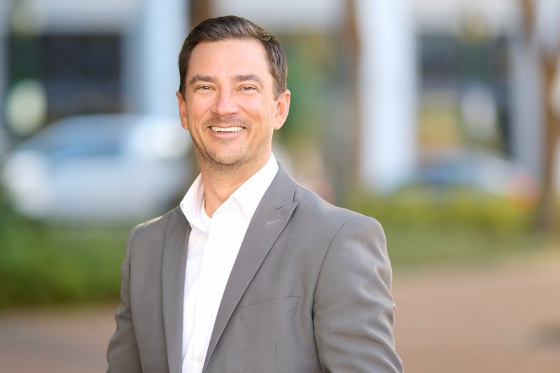 Zarghami Group portrait in downtown Sarasota — gray blazer and white shirt